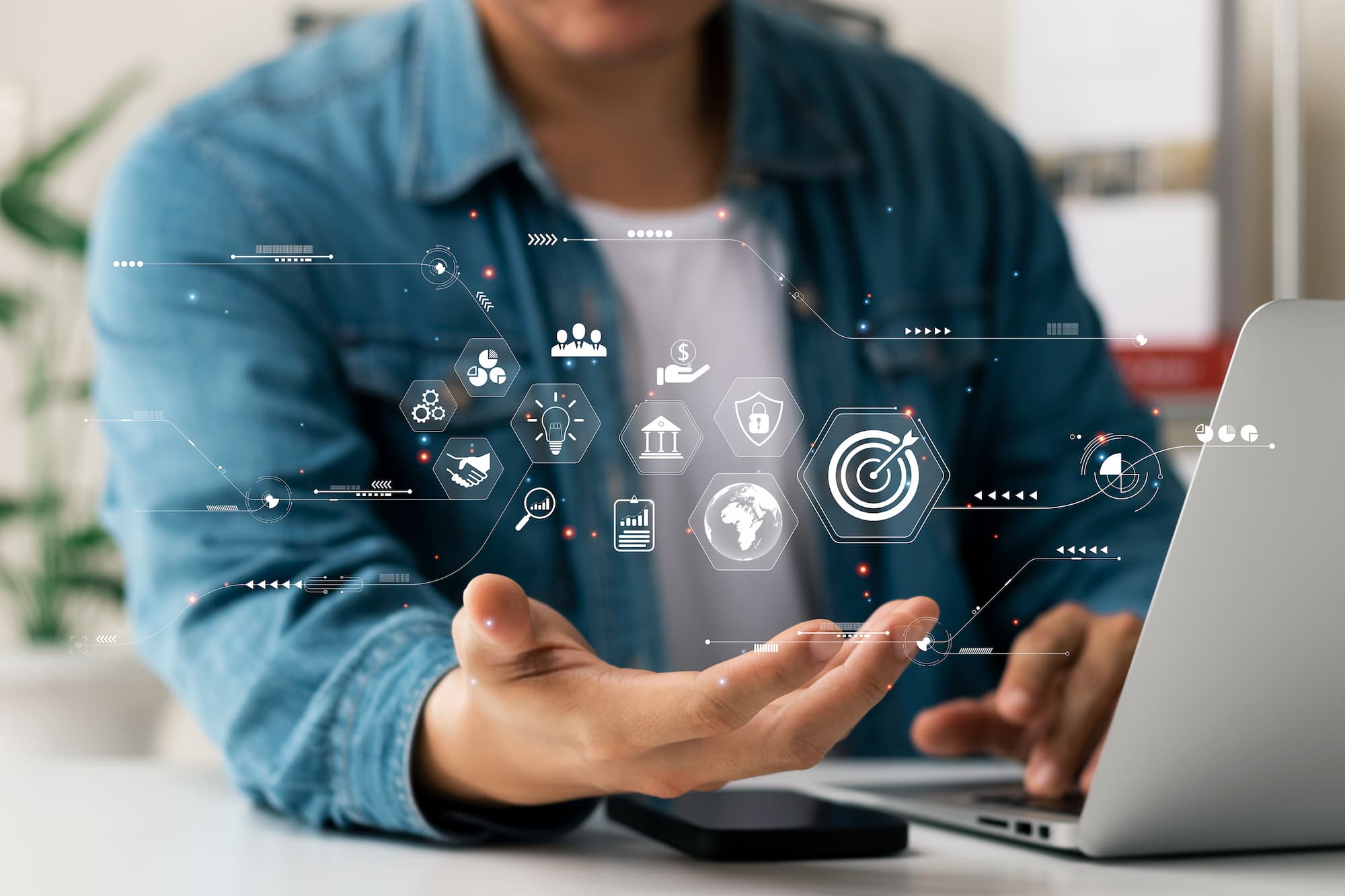 Xaas capa Mão de homem com projeções de ícones tecnológicos em referência ao xaas