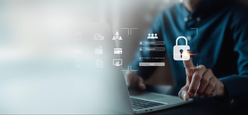  Tela de login de usuário em um computador, onde uma pessoa está digitando no teclado. O formulário de login exibe campos para e-mail ou nome de usuário e senha, com ícones ao redor para funções como upload, pesquisa e acesso a arquivos. Um copo de café está posicionado ao lado do laptop.